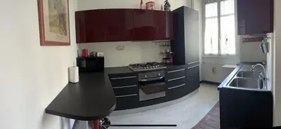 a kitchen with a black counter top and a sink at TRADITIONAL ROME Stay in Rome