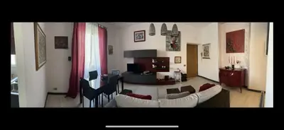 a living room with white couches and a table at TRADITIONAL ROME Stay in Rome