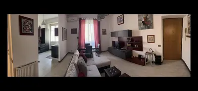 a view of a living room with a couch and a table at TRADITIONAL ROME Stay in Rome