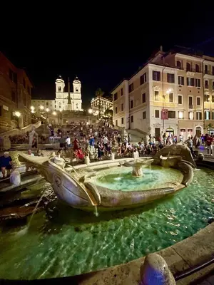 a group of people standing around a fountain in the water at Delizioso appartamento San Pietro in Rome