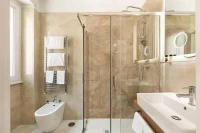 a bathroom with a shower and a sink at AlbaDea Deluxe in Rome
