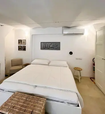 a bedroom with a large white bed in a room at GuestHost - Flaminio MM Comfy Loft - Piazza del Popolo in Rome