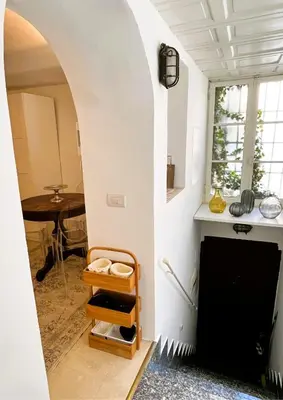 a living room with a fireplace and a table at GuestHost - Flaminio MM Comfy Loft - Piazza del Popolo in Rome