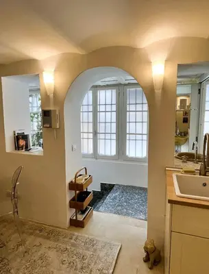 a kitchen with an archway and a sink at GuestHost - Flaminio MM Comfy Loft - Piazza del Popolo in Rome