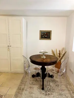 a dining room with a wooden table and chairs at GuestHost - Flaminio MM Comfy Loft - Piazza del Popolo in Rome