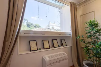 a window in a room with a air conditioner and a window with a window at MB SUITES Margutta in Rome