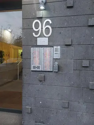 a sign on the side of a building with the number at I-LARI Apartment in Rome