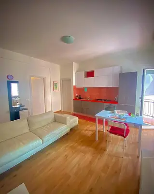 a living room with a couch and a table at I-LARI Apartment in Rome