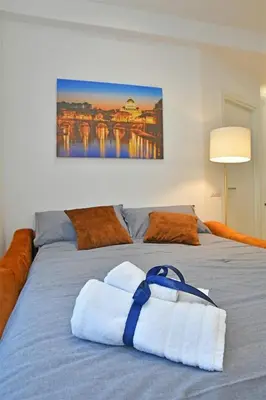 a bedroom with a bed with towels on it at Roma Clodio Holiday in Rome