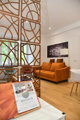 a living room with a couch and a table at Roma Clodio Holiday in Rome