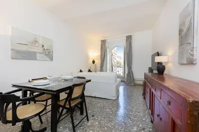 a living room with a dining room table and a bed at Angelico By Rental in Rome in Rome