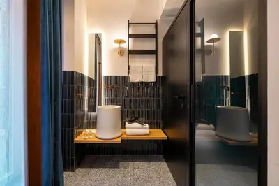 a bathroom with two sinks and two toilets at Palazzetto Symphony in Rome