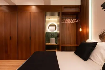 a bedroom with a bed and a mirror at Palazzetto Symphony in Rome