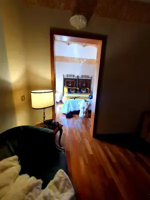 a living room with a bed and a mirror at 1878s by SC LUXURY HISTORIC HOUSE PIAZZA DI SPAGNA in Rome