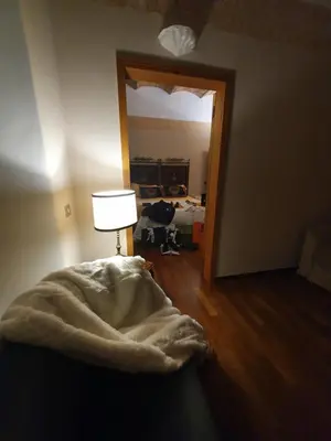 a room with a bed and a lamp and a mirror at 1878s by SC LUXURY HISTORIC HOUSE PIAZZA DI SPAGNA in Rome