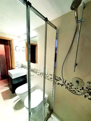 a bathroom with a shower and a toilet and a sink at 1878s by SC LUXURY HISTORIC HOUSE PIAZZA DI SPAGNA in Rome
