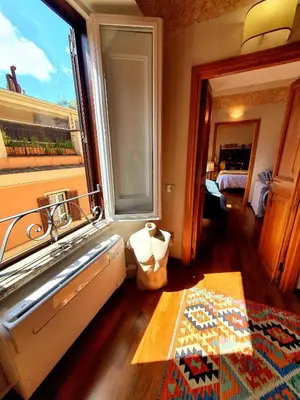 a room with a sink and a window and a bed at 1878s by SC LUXURY HISTORIC HOUSE PIAZZA DI SPAGNA in Rome