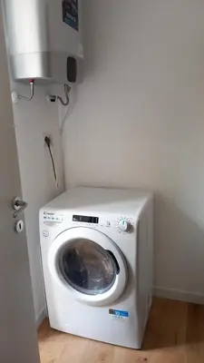a washer and dryer in a corner of a room at Designer Apartment Via Nazionale in Rome