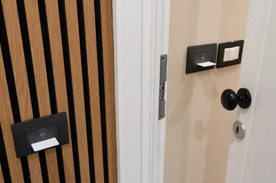 a door with two switches on a wall at Venturi Comfort in Rome