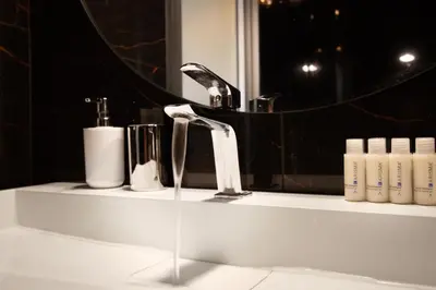 a bathroom counter with a sink and a mirror at Trastevere Loft in Rome