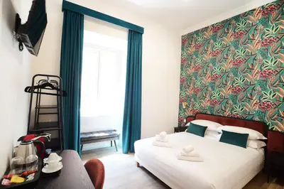 a bedroom with a large bed with a large window at San Cosimato 40 guesthouse in Rome