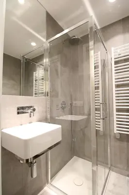 a bathroom with a sink and a shower at HT Luxury Altare della Patria in Rome