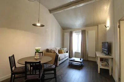 a living room with a table and a couch at HT Luxury Altare della Patria in Rome