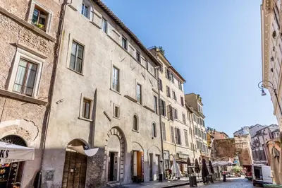 an old building in a street in a city at Casa Ghetto 13 in Rome
