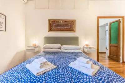 a bedroom with a bed with towels on it at Casa Ghetto 13 in Rome