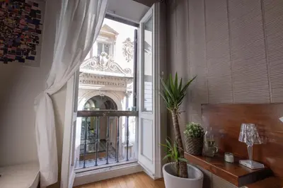 a room with a window with a view of a building at The Central View - DolceVite in Rome