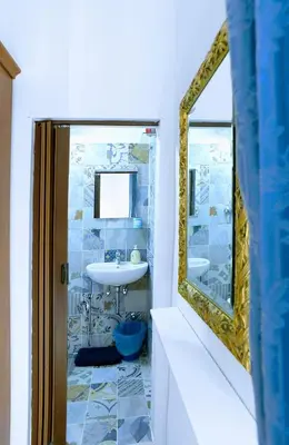 a bathroom with a sink and a mirror at PORTA MAGGIORE 9 ROMA Locazione Turistica in Rome