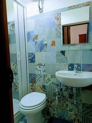 a bathroom with a toilet and a sink at PORTA MAGGIORE 9 ROMA Locazione Turistica in Rome
