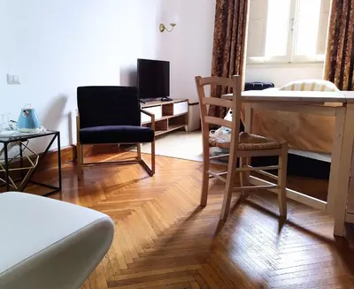 a living room with two chairs and a table at NiK in Rome