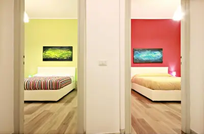 two beds in a room with two beds at Colosseum - Big and comfortable apartment in Rome