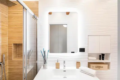 a bathroom with a sink and a mirror at Casa Borghese - Your perfect stay in Rome in Rome