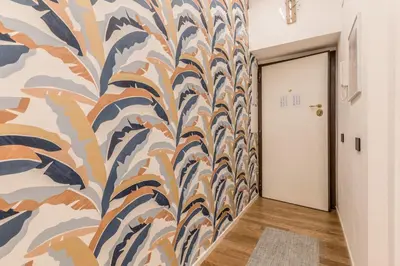 a hallway with a colorful mural on the wall at Casa Borghese - Your perfect stay in Rome in Rome