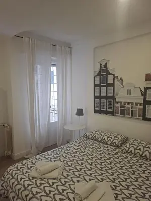 a bedroom with a bed with two stuffed animals on it at La Casa di G. in Rome