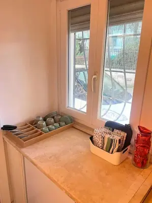 a kitchen with a counter top with a window at Residenza Morlupo (Fleming) in Rome