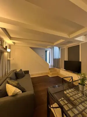 a living room with a couch and a table at Residenza Morlupo (Fleming) in Rome