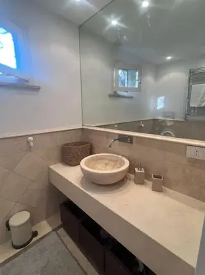 a bathroom with a sink and a mirror at Residenza Morlupo (Fleming) in Rome