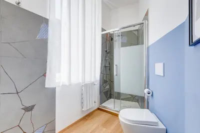 a bathroom with a toilet and a shower at Villa Chiara - a new Luxury Star is born in Rome! in Rome