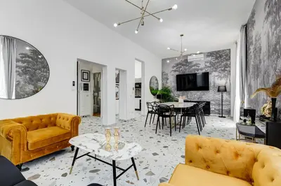 a living room with a couch and a table at Villa Chiara - a new Luxury Star is born in Rome! in Rome