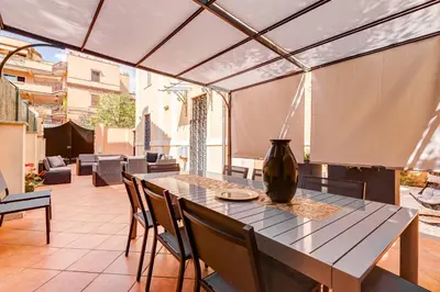 a dining room with a table and chairs at Villa Chiara - a new Luxury Star is born in Rome! in Rome