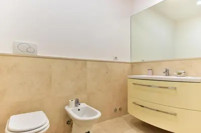 a bathroom with a toilet and a sink at Elite Rome apartments 3 in Rome