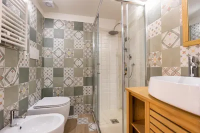 a bathroom with a toilet and a sink and a shower at Vatican Vita Apartment in Rome