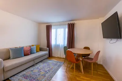 a living room with a couch and a table at Vatican Vita Apartment in Rome
