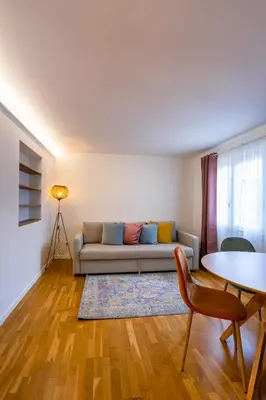 a living room with a couch and a table at Vatican Vita Apartment in Rome
