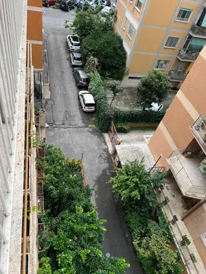 an aerial view of a city street with cars parked at Casa Arya in Rome