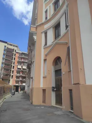 a tall building with a door on the side of it at TIBERIVS Home in Rome