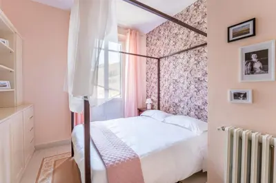 a small bedroom with a bed and a window at Elizabeth Penthouse, Charmy Apartment in Little London 10 Min From the Center in Rome